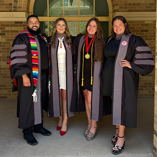 Kayla with some friends after graduation