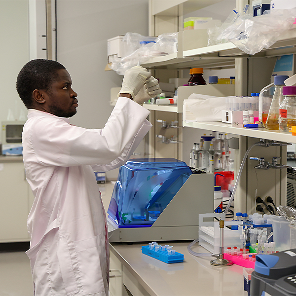 Idris in the research lab looking at results