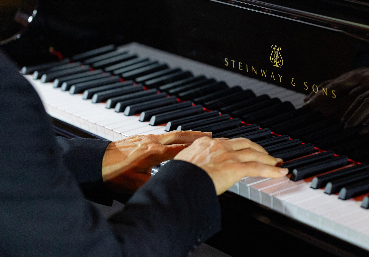 Person playing steinway piano
