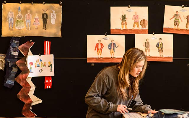 Student painting on canvas