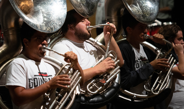 School of music students playing tubas width=