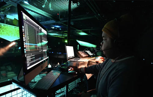 Student in music studio in front of a computer