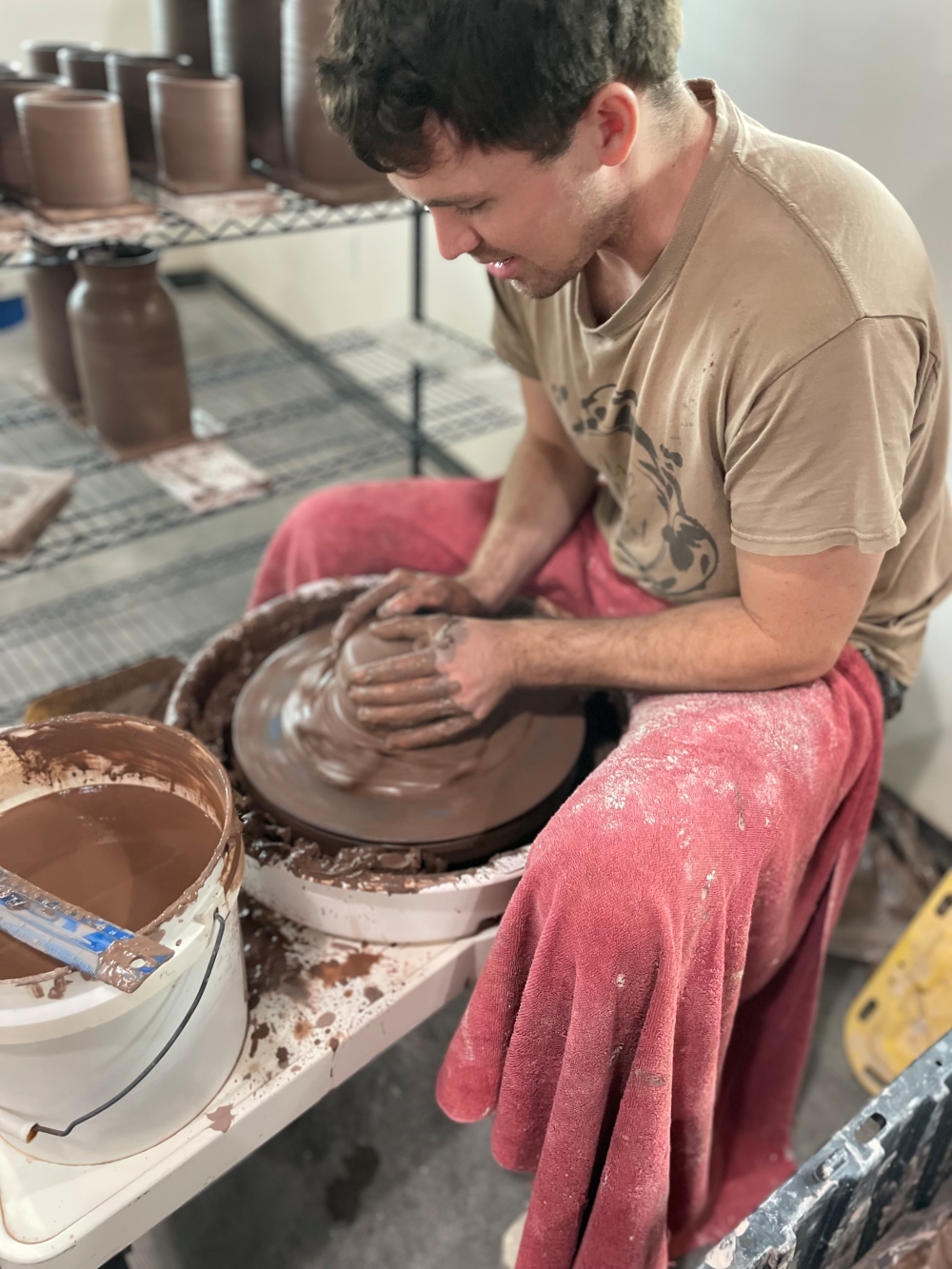 Hunter Marze working at potters wheel