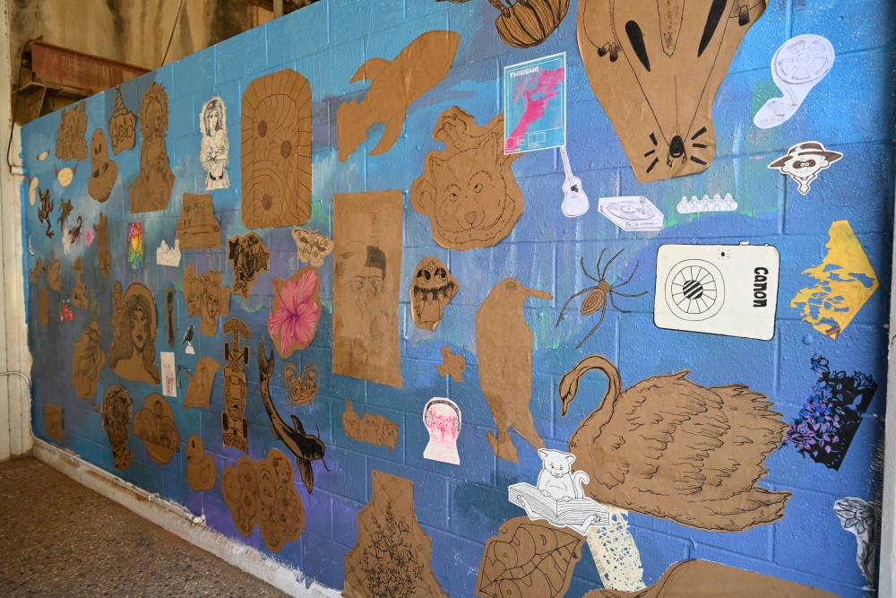 Wall mural by art students with wheat paste application