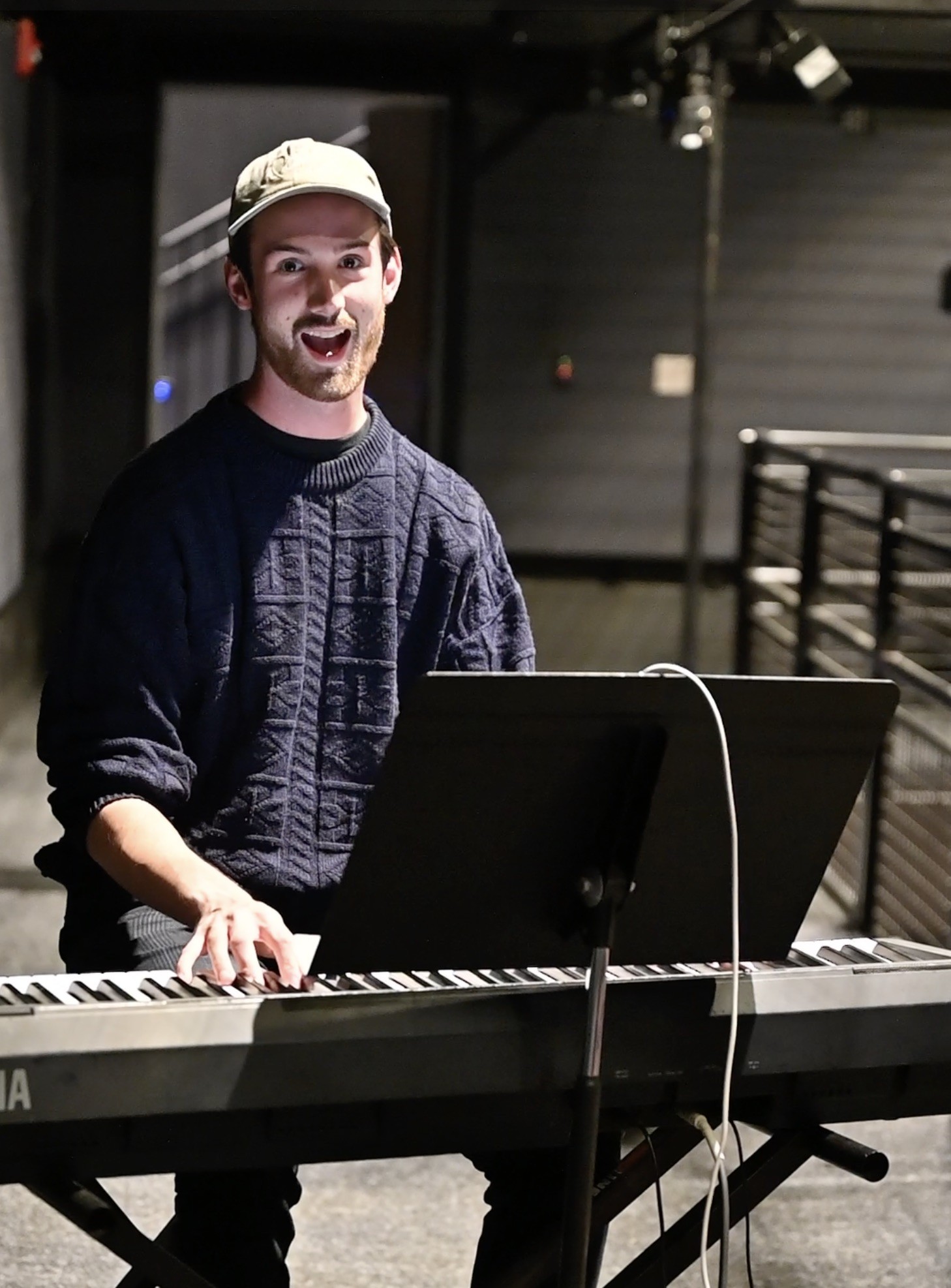Seb Archibald sitting at keyboard smiling