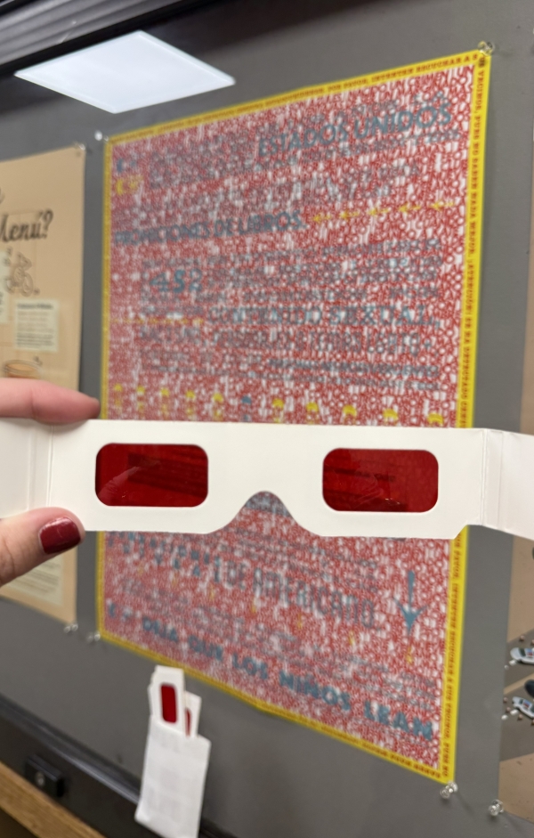 Graphic Design poster by Madelyn Hopper and Rylee Tucker with 3D glass in foreground