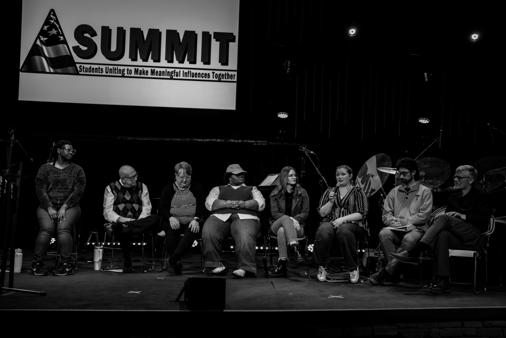 Texas Tech School of Theatre & Dance students and faculty sitting and speaking on stage during the Youth SUMMIT.